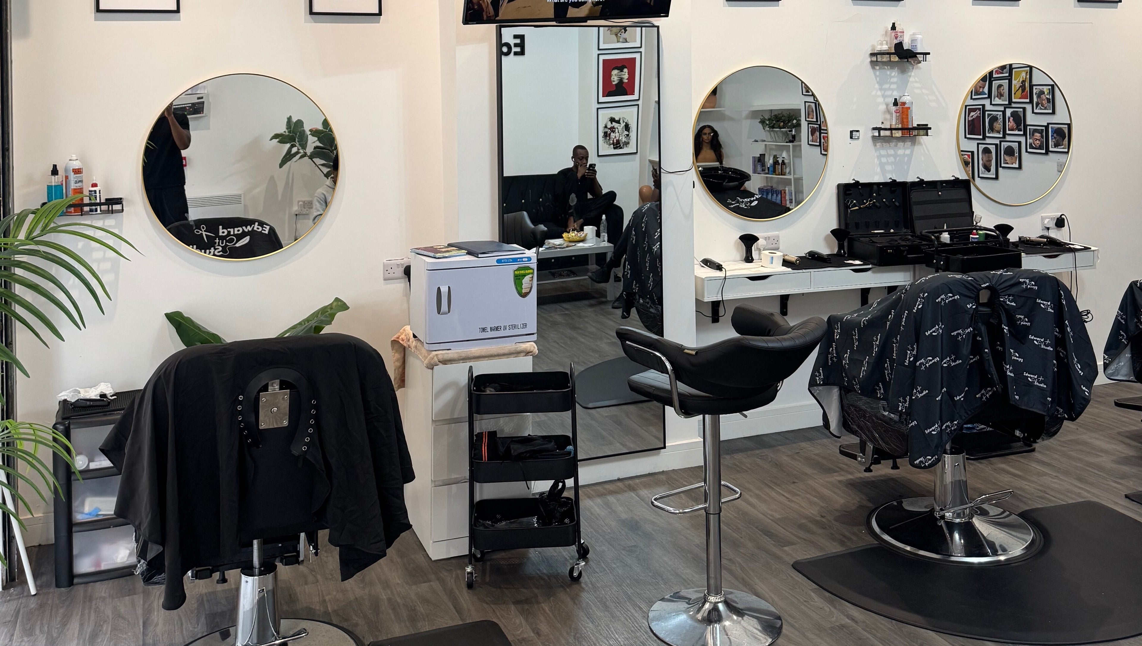 Interior of Edward Cut Studio in Bradford, England, GB showing stylish salon chairs and mirrors.