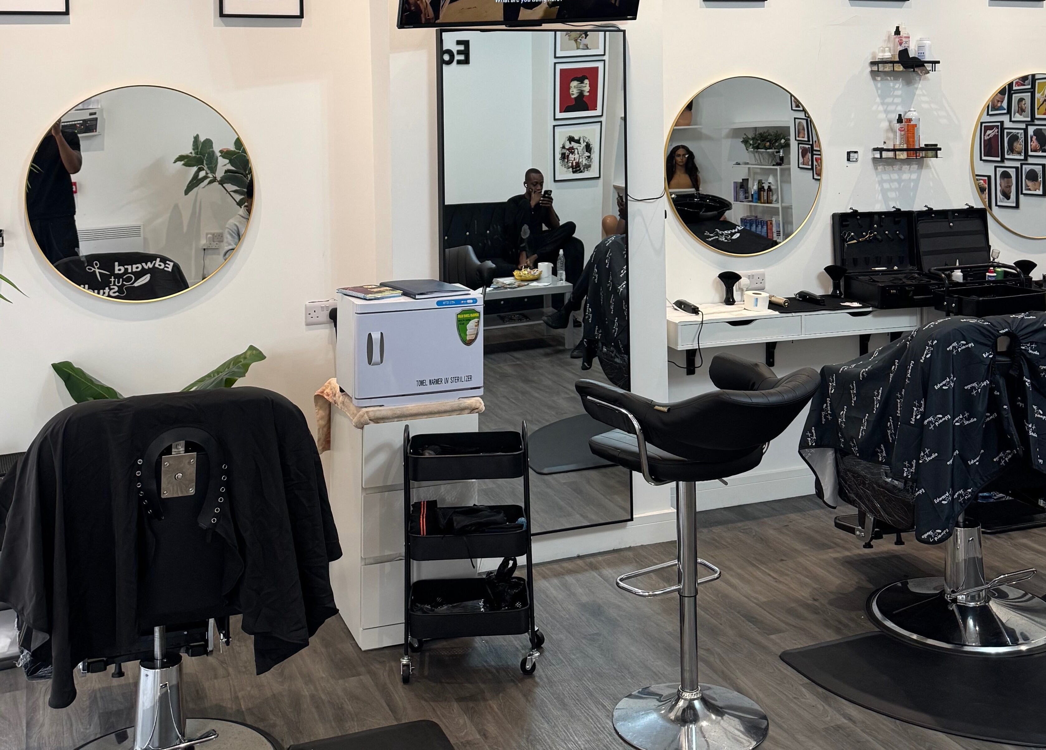 Interior of Edward Cut Studio in Bradford, England, GB showing stylish salon chairs and mirrors.