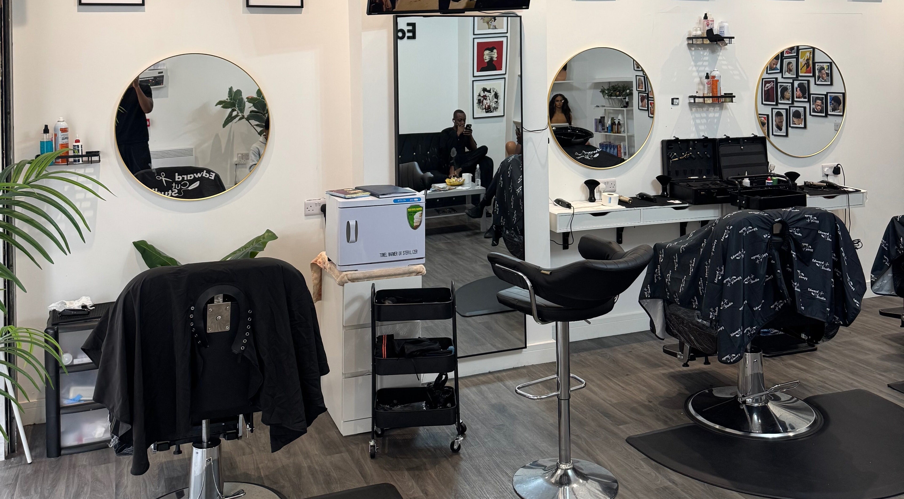 Interior of Edward Cut Studio in Bradford, England, GB showing stylish salon chairs and mirrors.