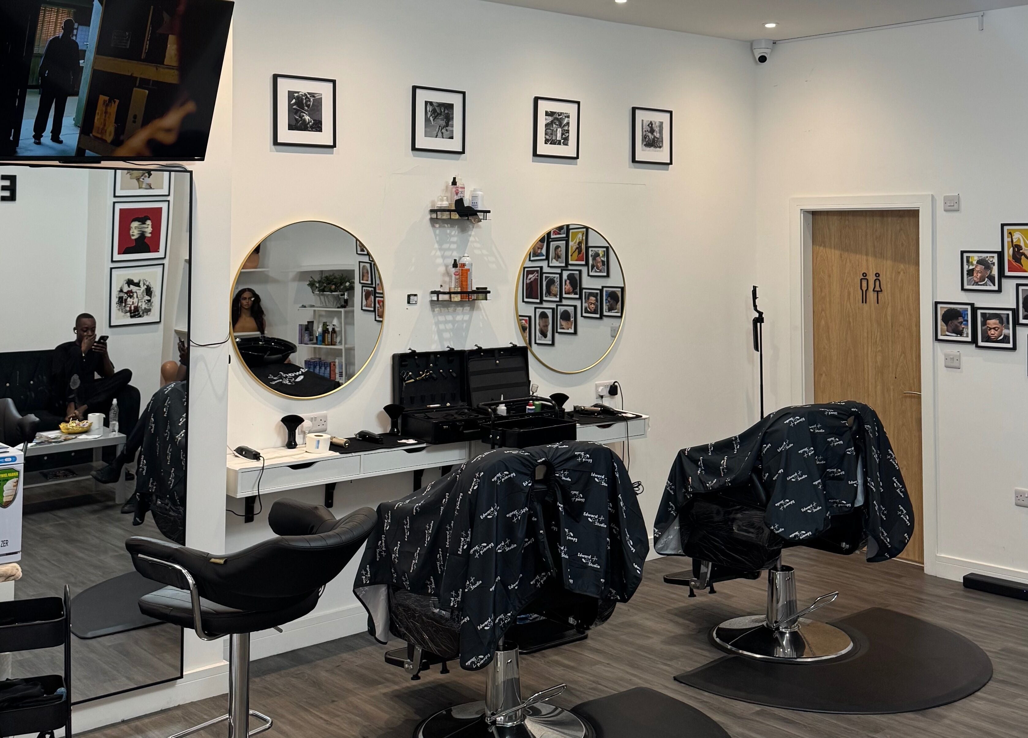 Contemporary interior of Edward Cut Studio in Bradford, England, GB with stylish mirrors and professional tools.