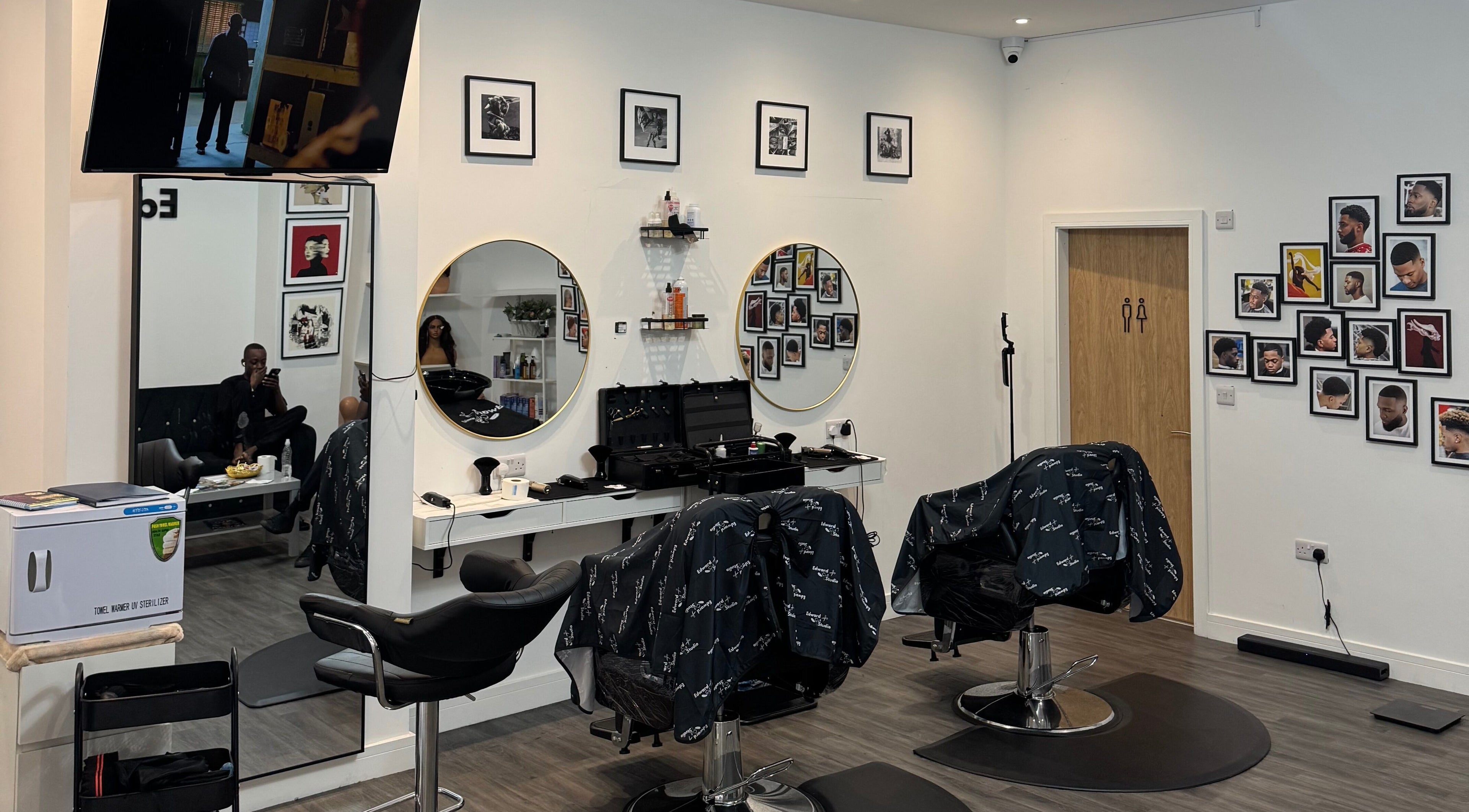 Contemporary interior of Edward Cut Studio in Bradford, England, GB with stylish mirrors and professional tools.
