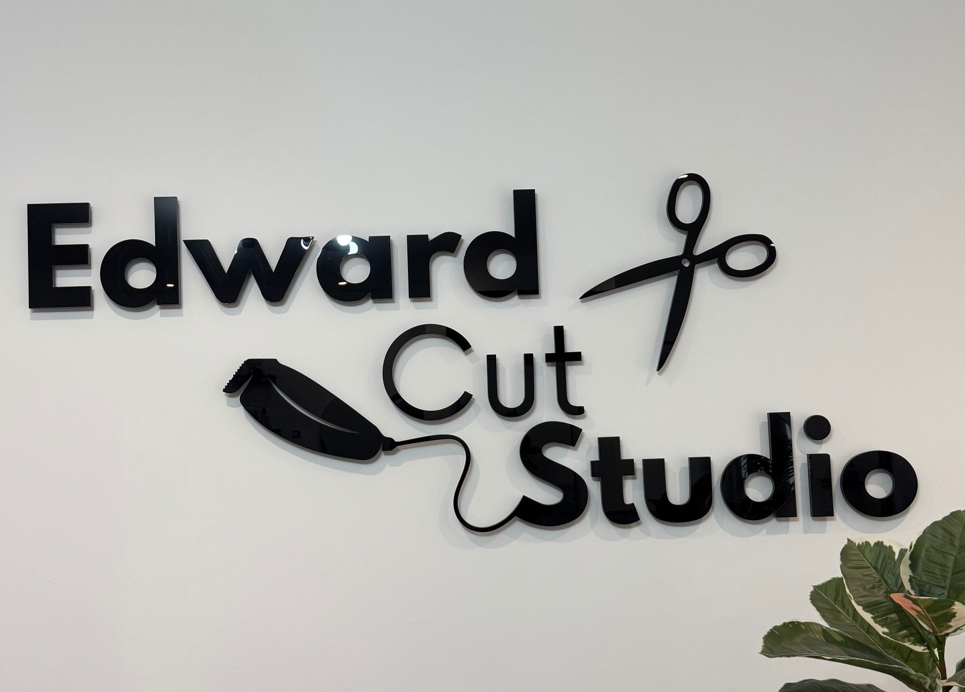 Edward Cut Studio logo with scissors and plant in Bradford, England, GB.
