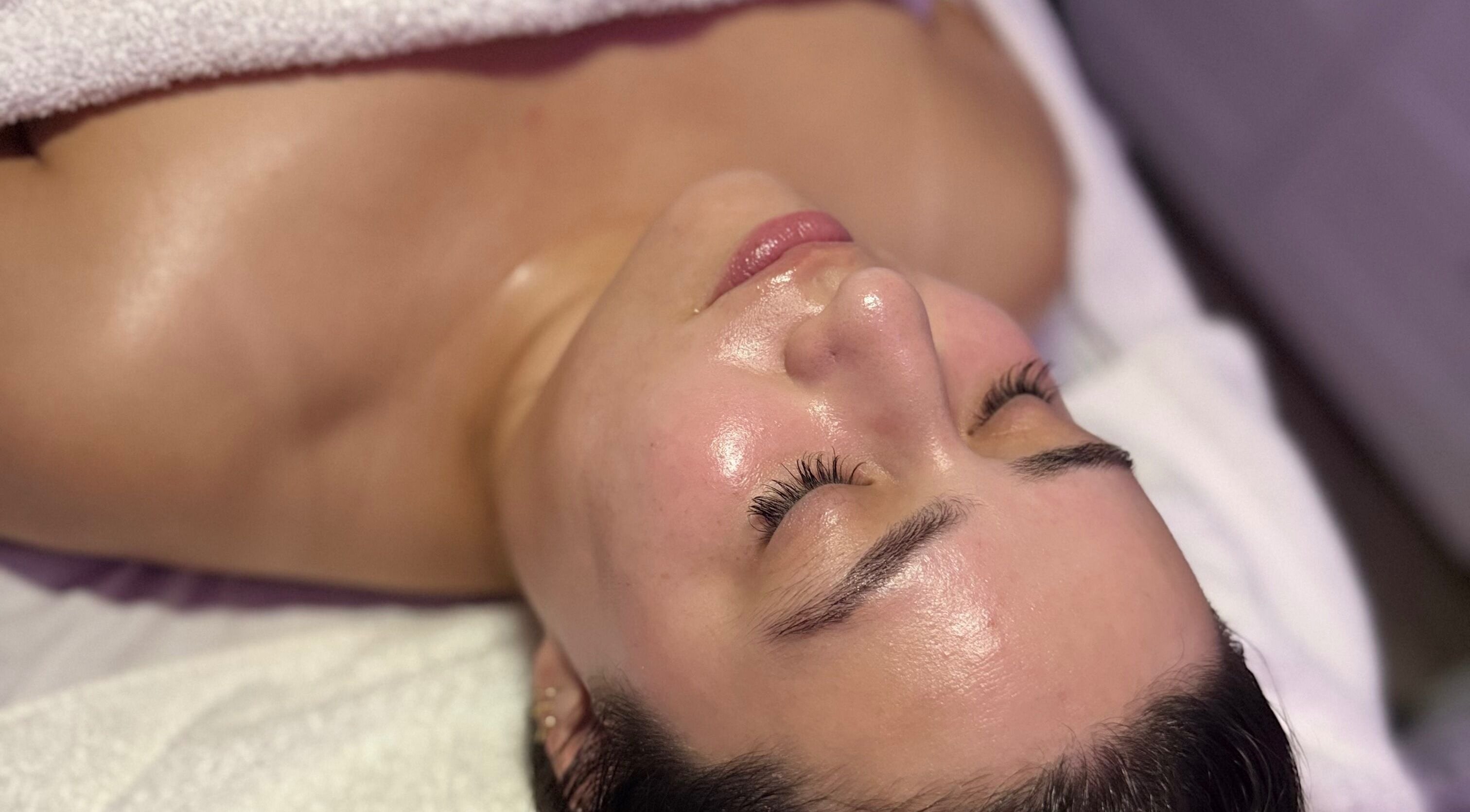 A glowing face receiving treatment at Sanisknn in Huntington Park, California, US for relaxation and rejuvenation.