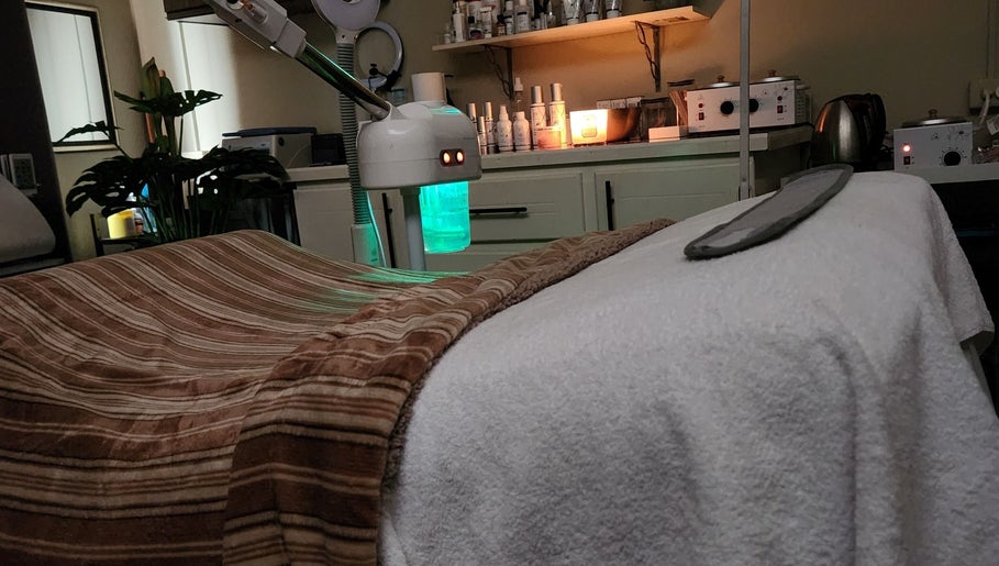 Cozy spa room at Beautiful Bodies, Warrenville, Cunupia, TT with massage table and calming ambiance.