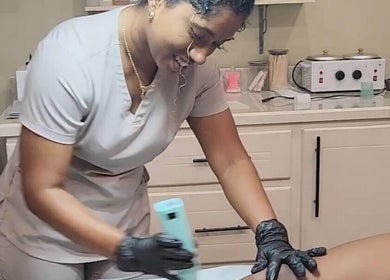 Therapist at Beautiful Bodies, Warrenville, Cunupia, TT, providing a relaxing skincare treatment.