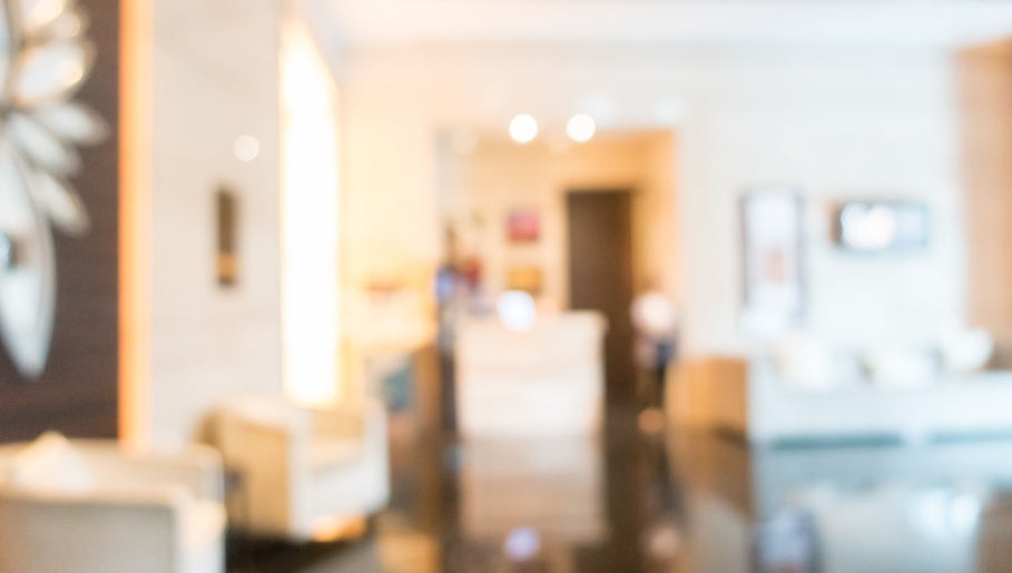 Chic interior of Confidence By Angela Randeniya, Melbourne, Victoria, AU with modern seating and soft lighting.