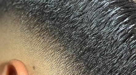 Close-up of a fresh haircut fade at Brito_TheBarber, Paramaribo, Paramaribo, SR showcasing expert styling.