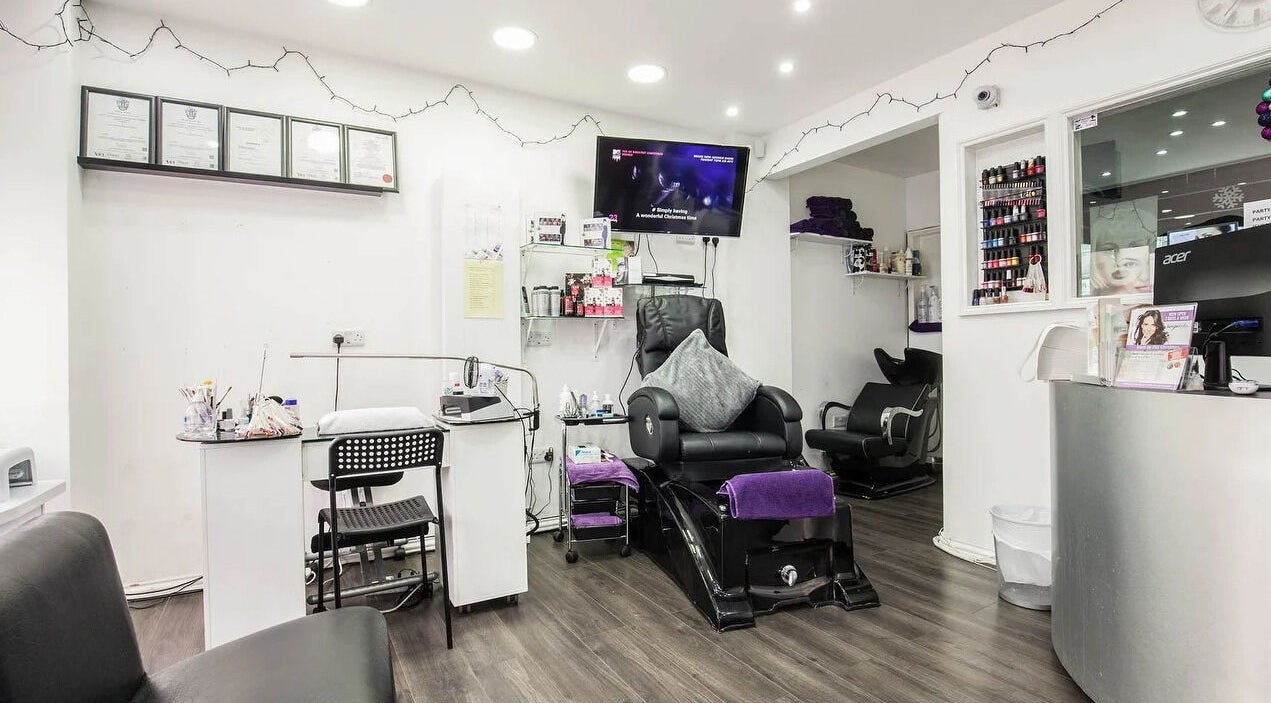 Inside Sugilite Therapeutic & Skin Care Services Ltd, Ilford, England, GB, featuring sleek salon chairs and equipment.