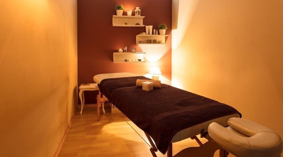 Cozy massage room at Mobile - Velvet Touch Maalish, Hounslow, England, GB, with warm lighting and tidy decor.