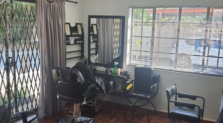 Glam Ink Hair salon with stylish chairs and mirrors in Benoni, Gauteng, ZA.