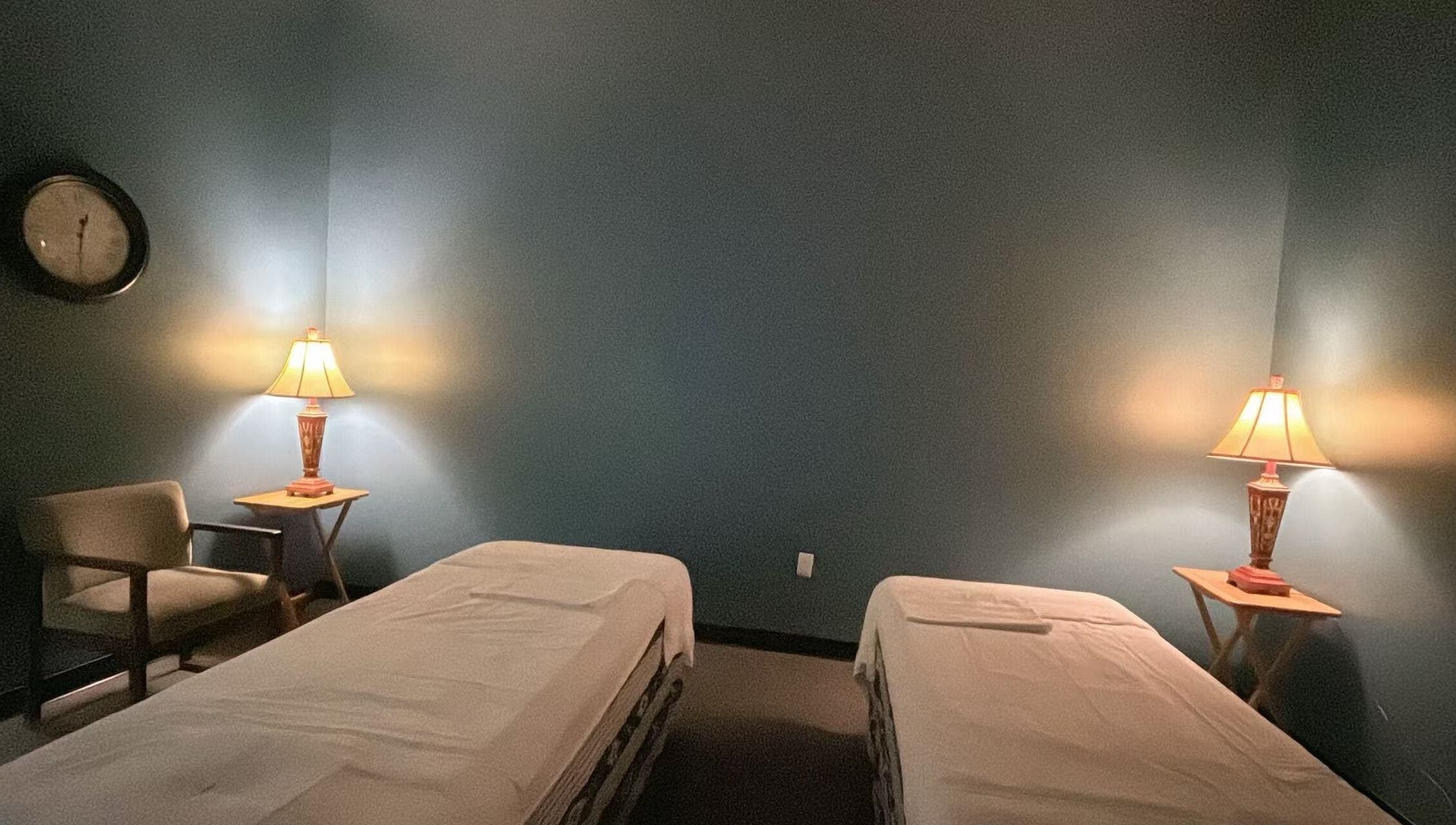Calm massage room with twin beds at Lotus Massage Spa, Chesterfield, Michigan, US.