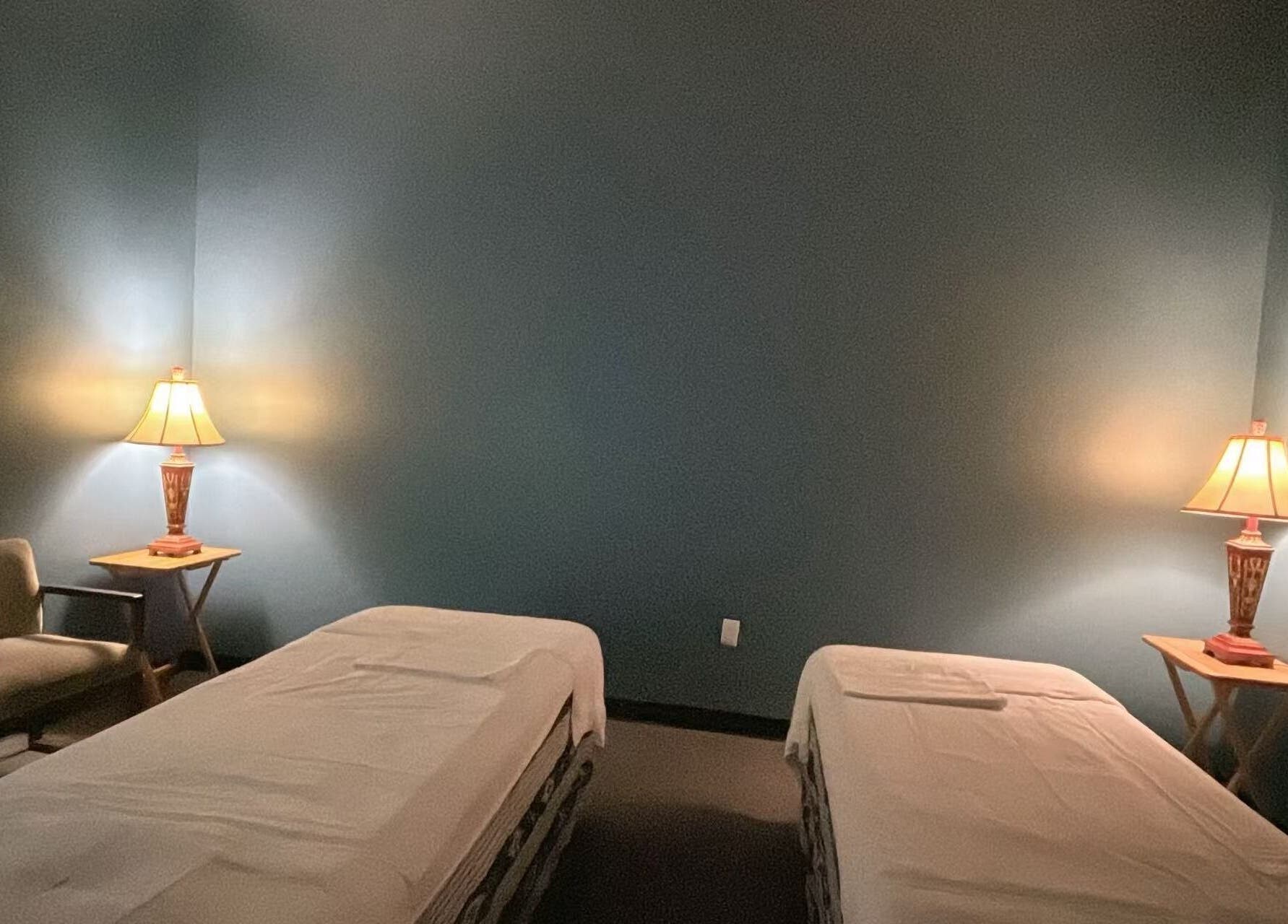 Calm massage room with twin beds at Lotus Massage Spa, Chesterfield, Michigan, US.