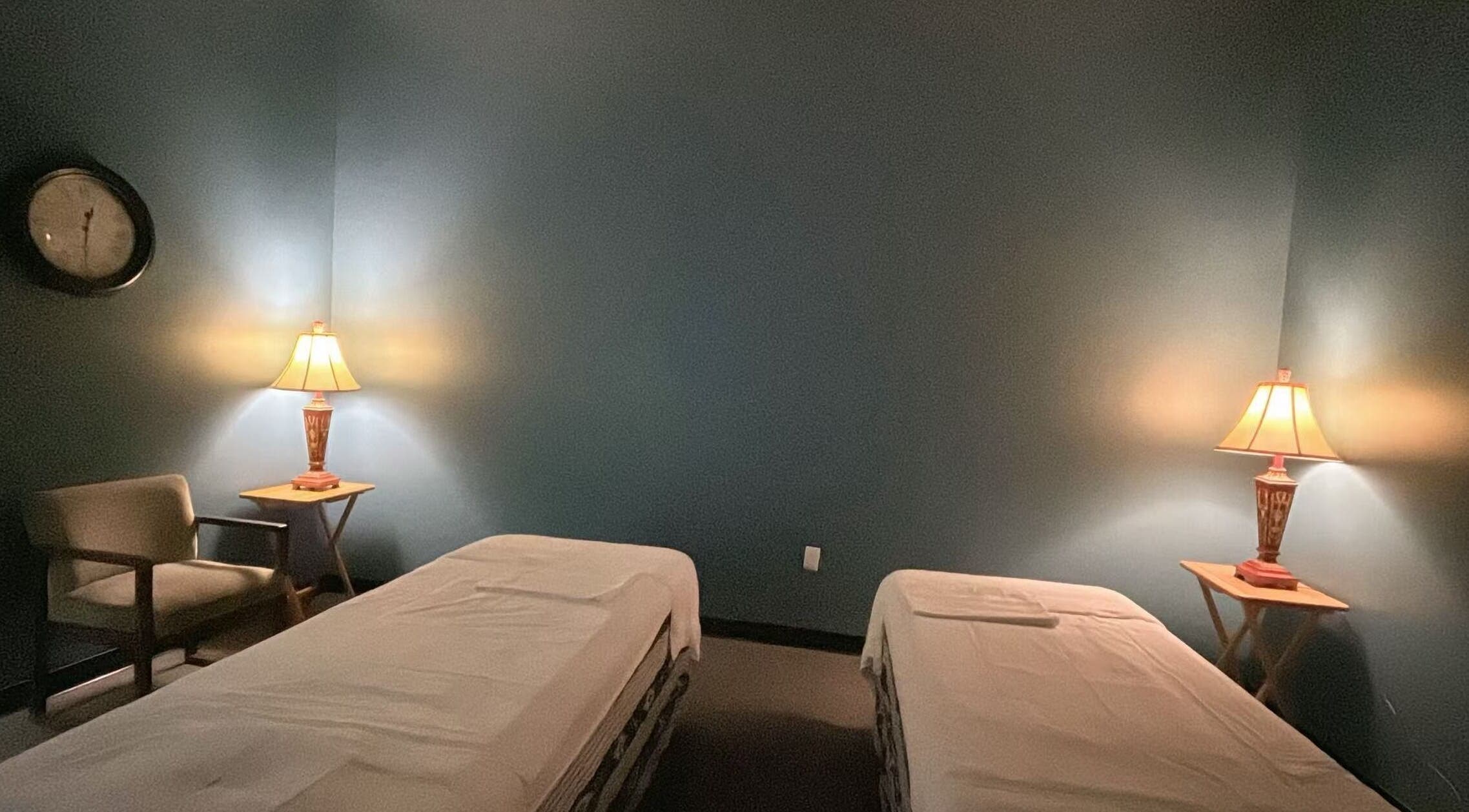Calm massage room with twin beds at Lotus Massage Spa, Chesterfield, Michigan, US.