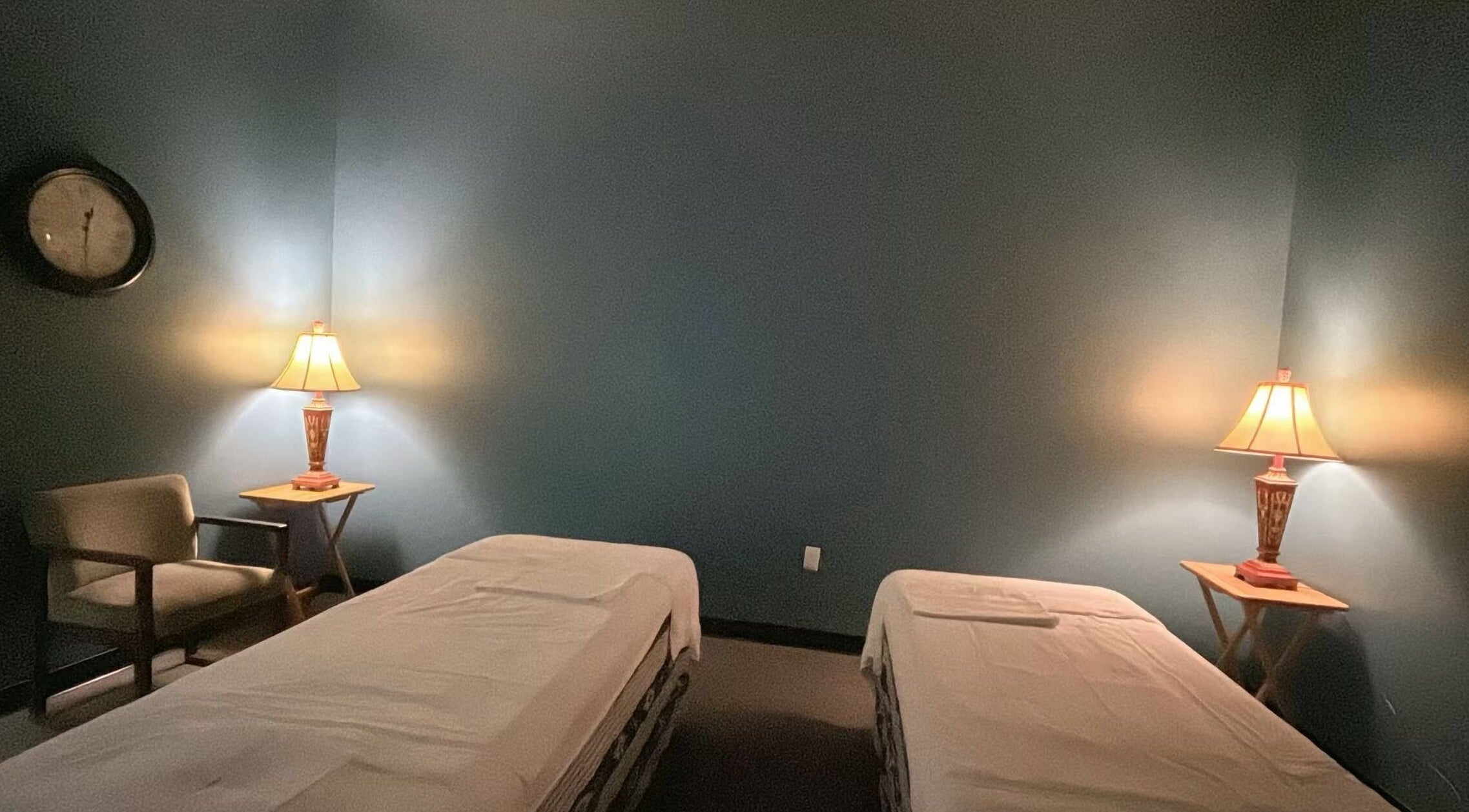 Calm massage room with twin beds at Lotus Massage Spa, Chesterfield, Michigan, US.