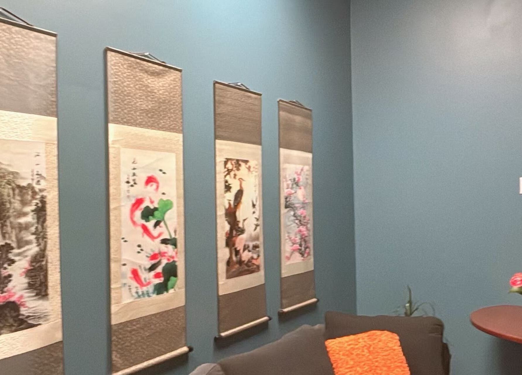 Tranquil room with art and flowers at Lotus Massage Spa, Chesterfield, Michigan, US.