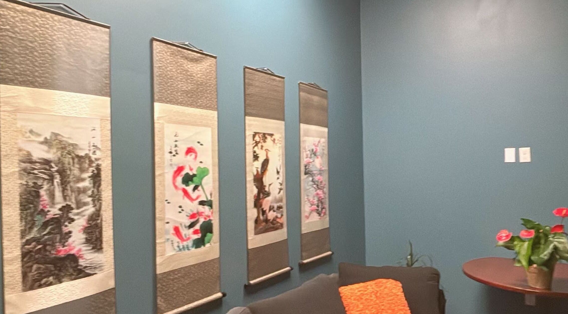 Tranquil room with art and flowers at Lotus Massage Spa, Chesterfield, Michigan, US.