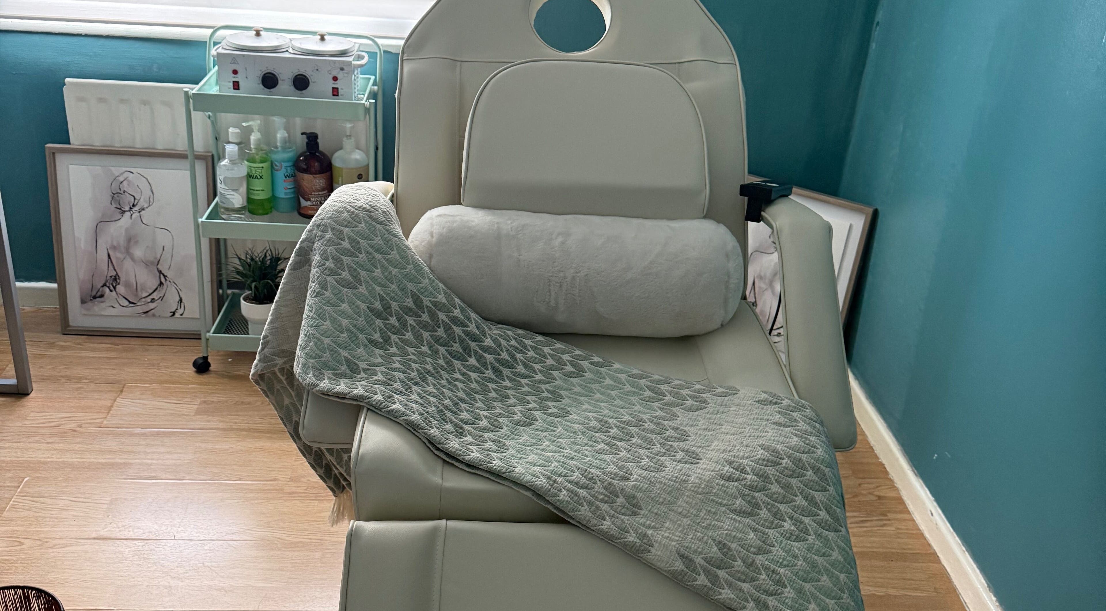 Relaxing treatment chair at FMac Beauty in Middlesbrough, England, GB, with cozy blanket and spa essentials.