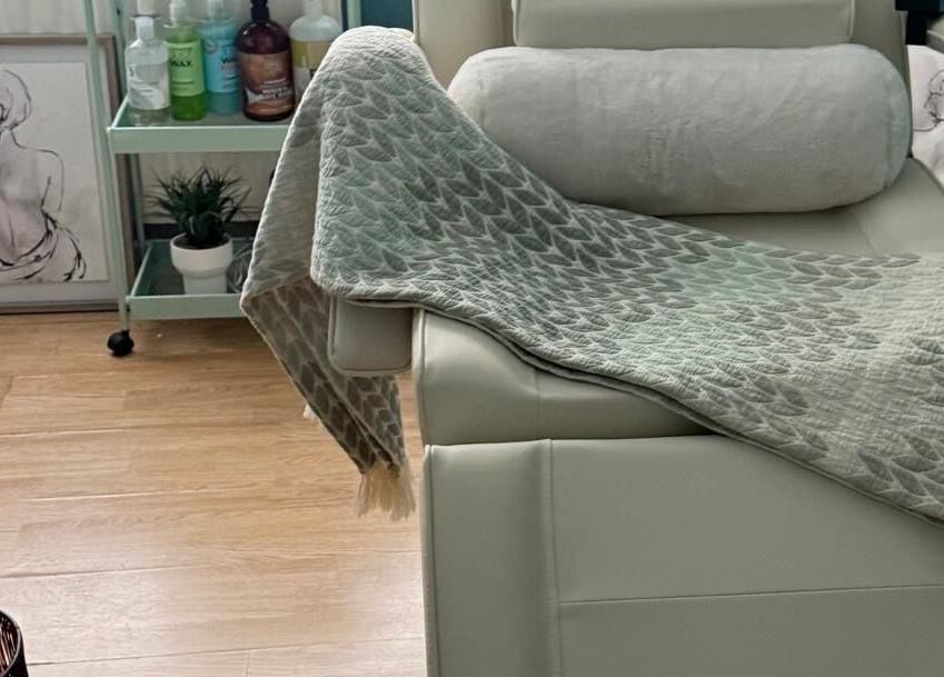 Cozy treatment chair at FMac Beauty, Middlesbrough, England, GB, with soothing decor for relaxation.