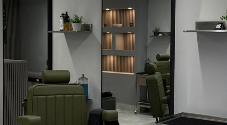 Modern interior of Mist Male Grooming in Dunmurry, Northern Ireland, GB with sleek barber chair and shelves.