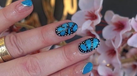 Blue and black butterfly nail art at Palm Springs Hair and Beauty, Margate, England, GB.