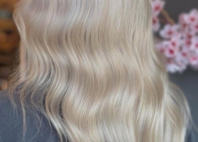 Blonde wavy hairstyle at Palm Springs Hair and Beauty, Margate, England, GB. Elegant salon look.