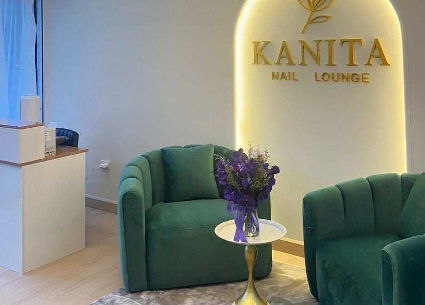 Elegant seating at Kanita Nail Lounge, Tambon Hua Hin, Chang Wat Prachuap Khiri Khan, TH, with green chairs and flowers.