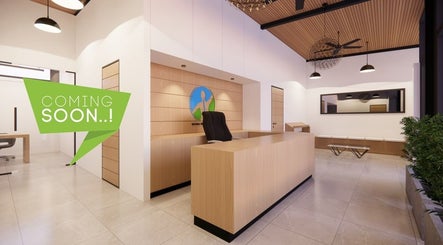 Welcoming reception area at Natural Wellness Center, Phnom Penh, featuring modern wooden decor.