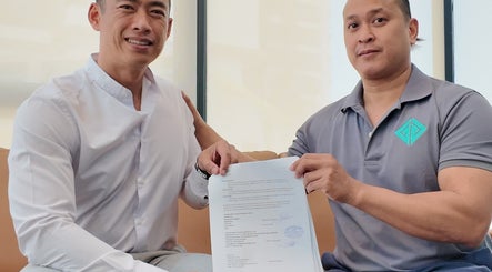 Two individuals celebrating a partnership signing at Go gym, Phnom Penh, Phnom Penh, KH.