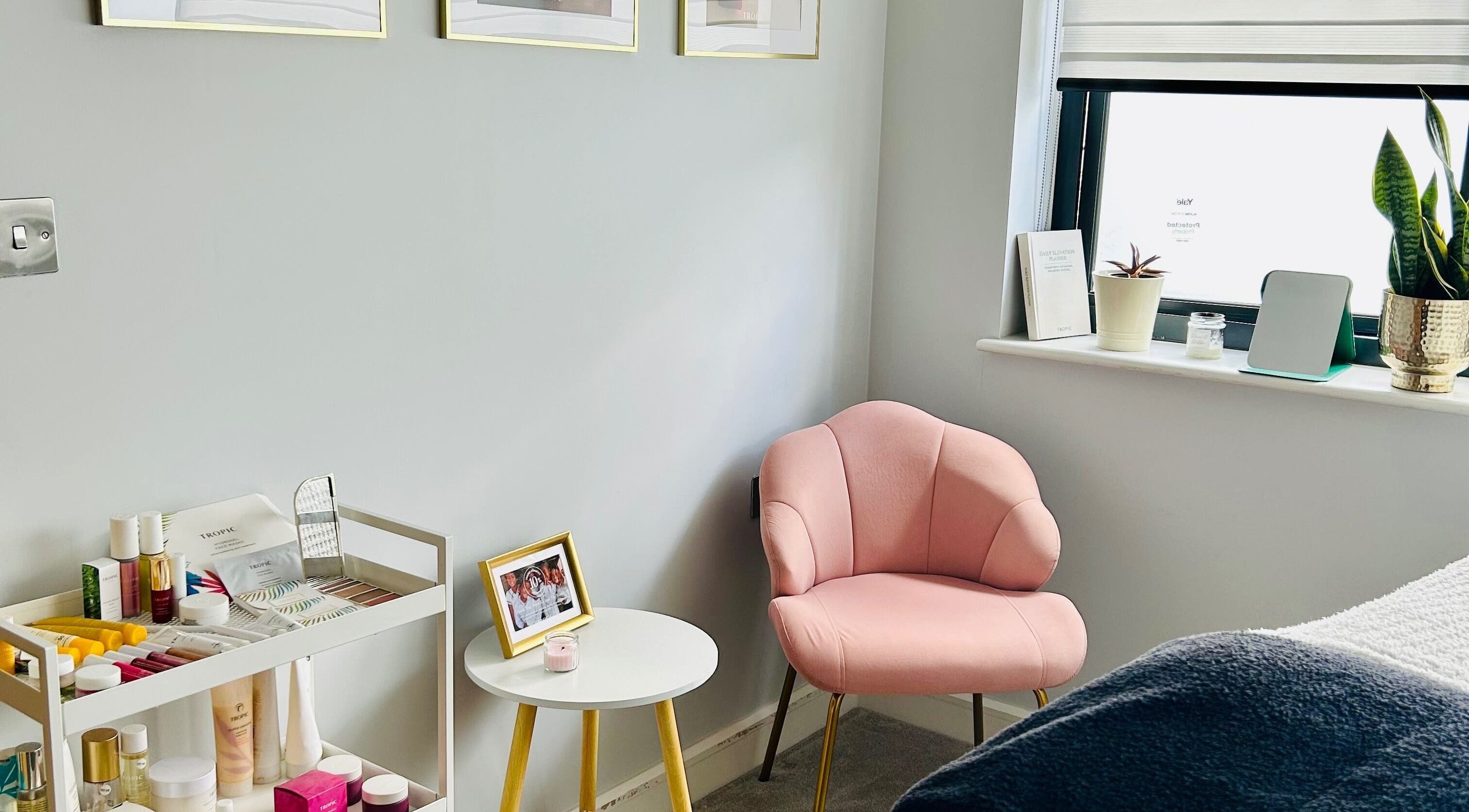 Cozy corner at VF Skincare & Facials with pink chair and skincare products in Winchester, England, GB.