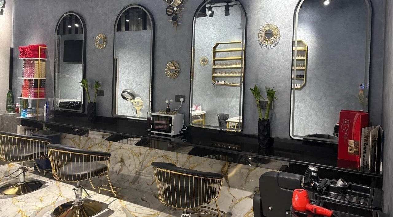 Modern chic salon interior at Lamasat Al Yasmin Beauty Salon, Dubai, Dubai, AE, featuring sleek mirrors and stylish chairs.