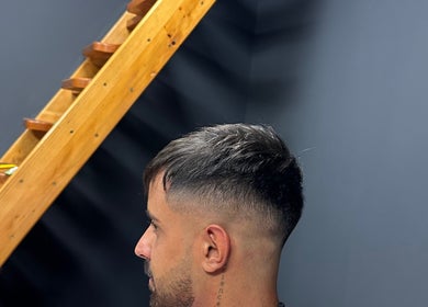 Man with a trendy fade haircut at Berbernica Trisa, Beograd, batajnica, RS.
