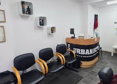 Interior of Urban Kutz in Stretford, England, GB, featuring seating area and reception desk.
