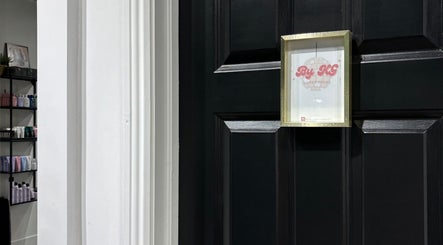 Entrance to ByKG Lashes & Brows in Swords, County Dublin, IE with elegant black door and signage.
