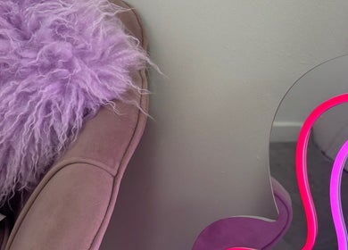 Lavender fur chair and neon mirror at ByKG Lashes & Brows in Swords, County Dublin, IE.