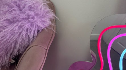 Lavender fur chair and neon mirror at ByKG Lashes & Brows in Swords, County Dublin, IE.