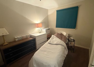 Comfortable treatment room at You Beauty, Bathgate, Scotland, GB. Warm lighting and soothing ambiance.