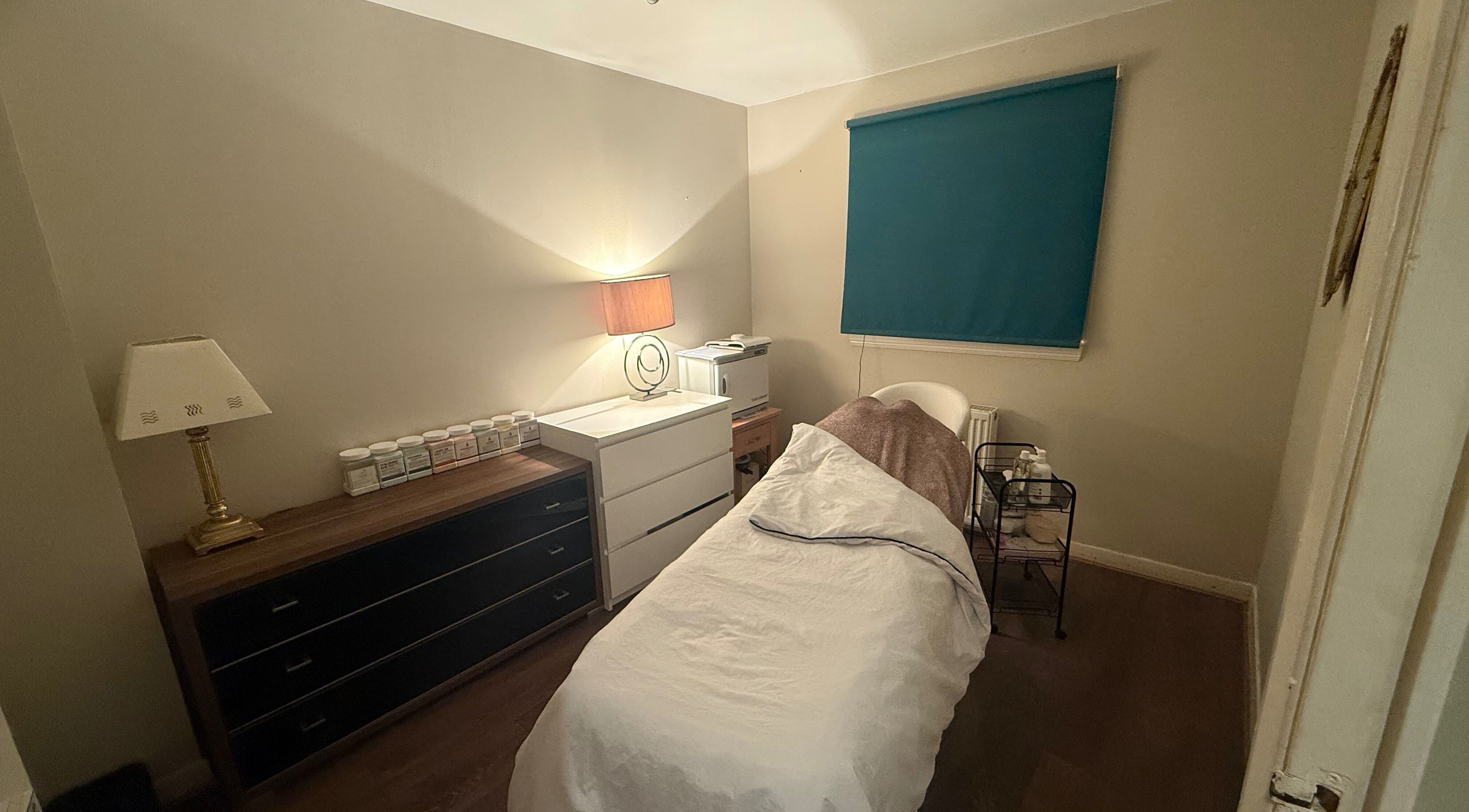 Comfortable treatment room at You Beauty, Bathgate, Scotland, GB. Warm lighting and soothing ambiance.