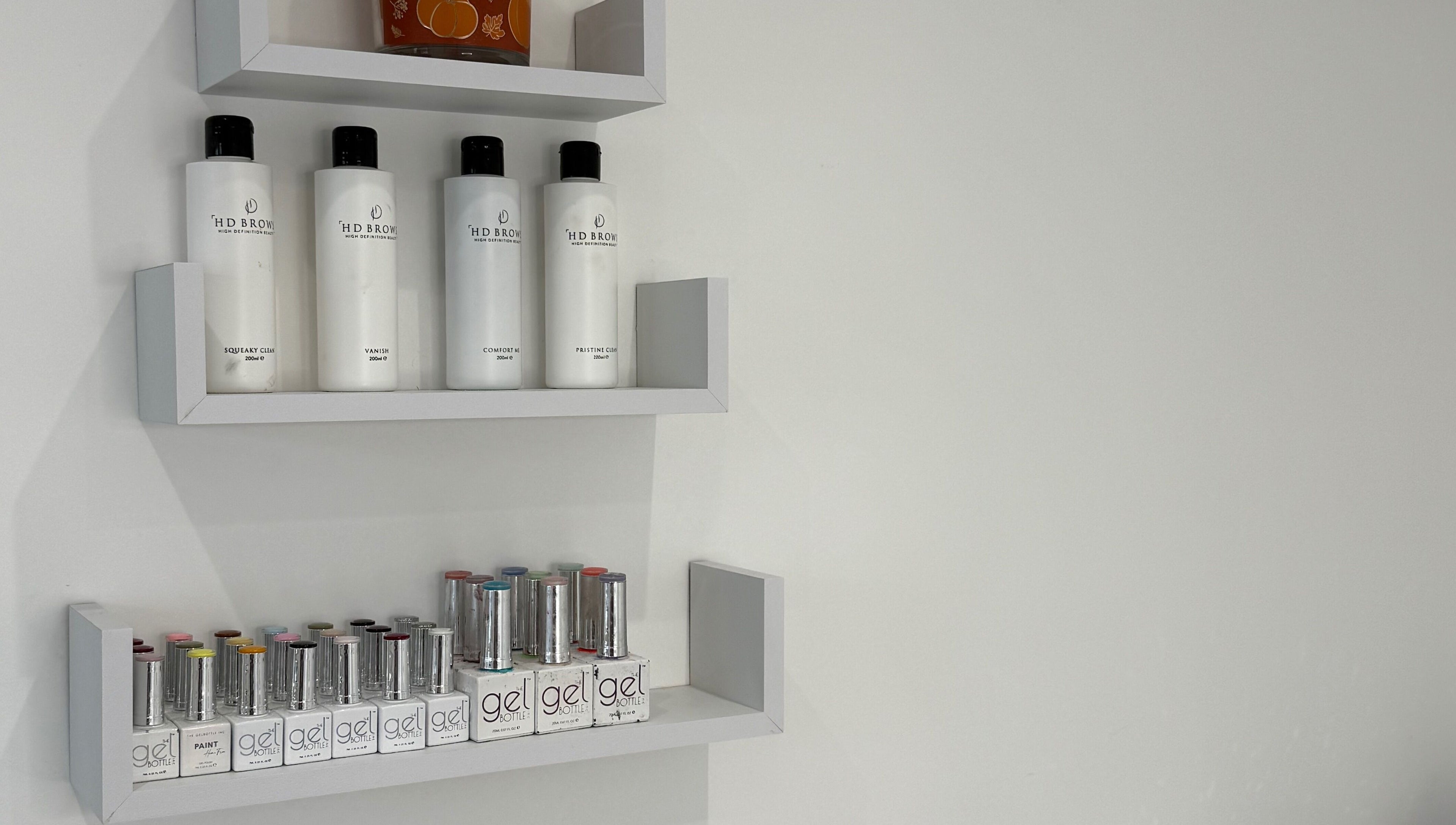 Product shelves at Modern Beauty, Newport, Wales, GB showcasing premium beauty products and gels.