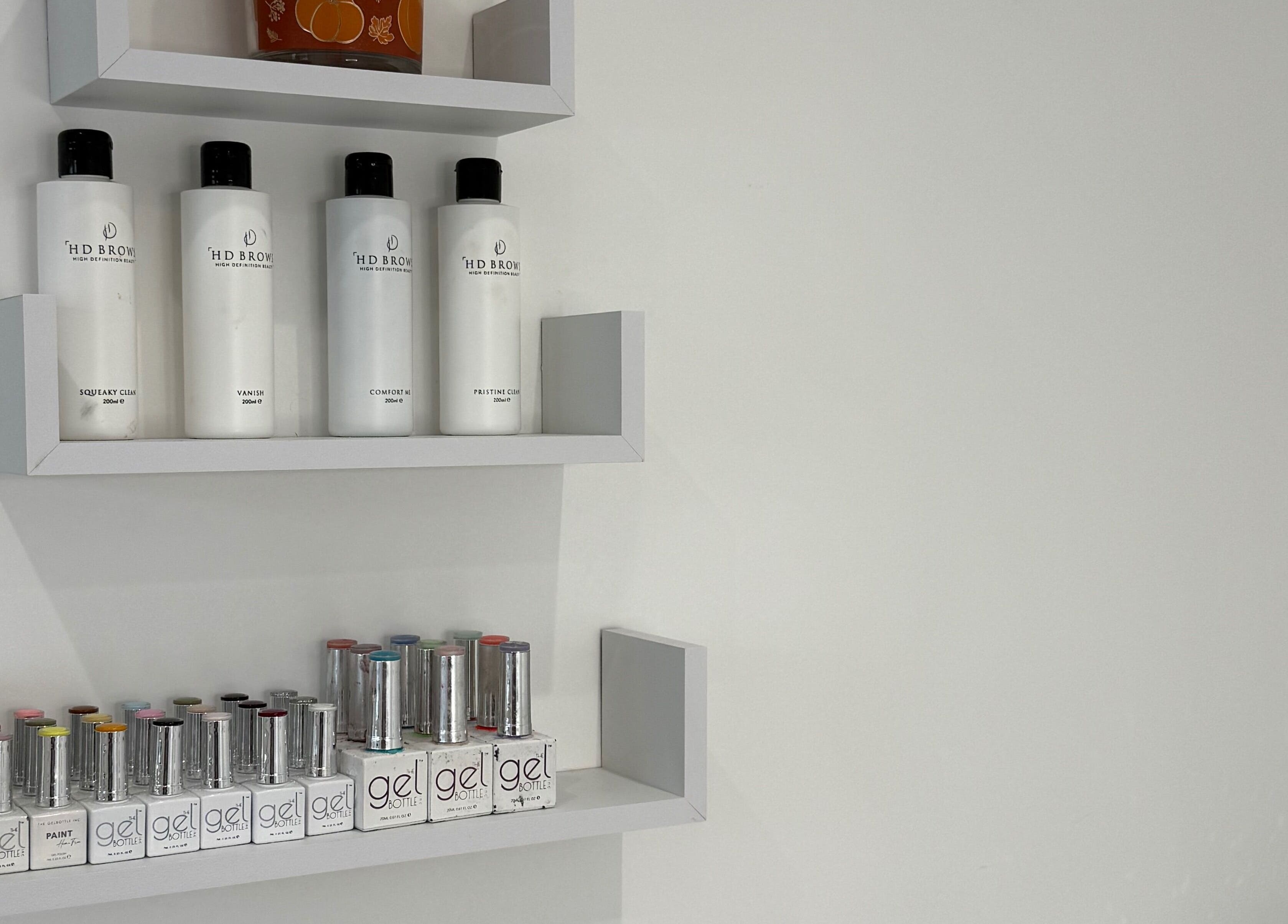 Product shelves at Modern Beauty, Newport, Wales, GB showcasing premium beauty products and gels.