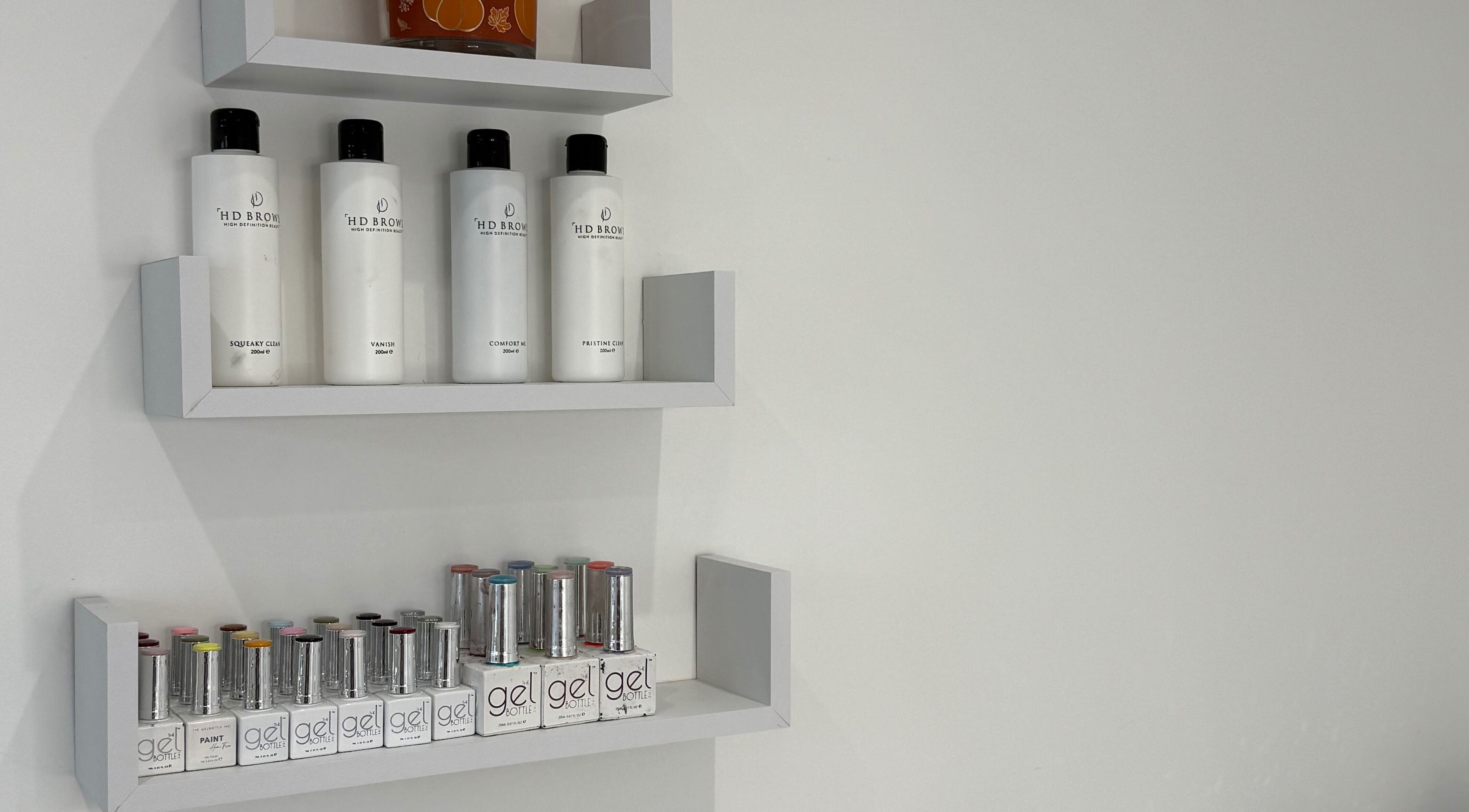 Product shelves at Modern Beauty, Newport, Wales, GB showcasing premium beauty products and gels.