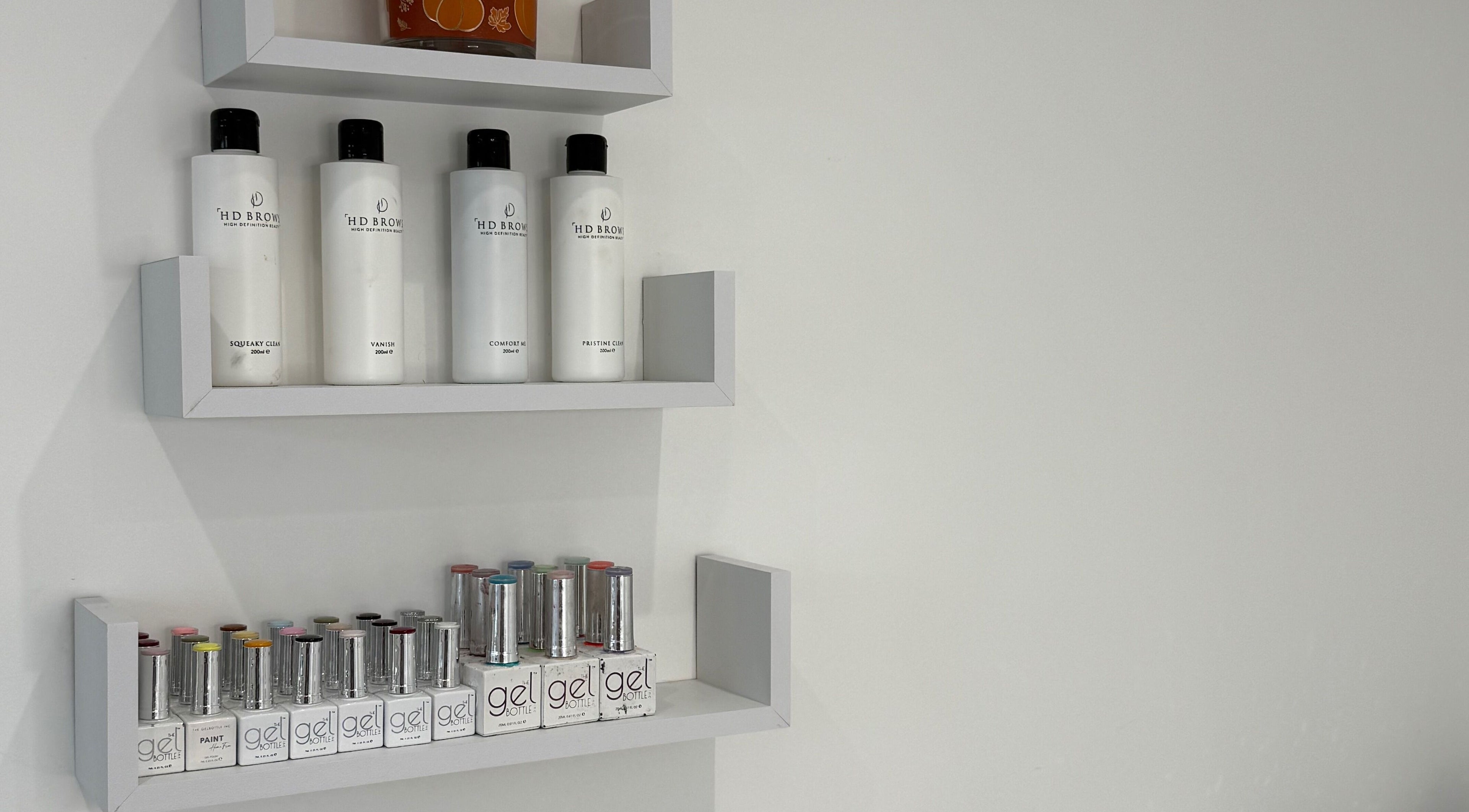 Product shelves at Modern Beauty, Newport, Wales, GB showcasing premium beauty products and gels.