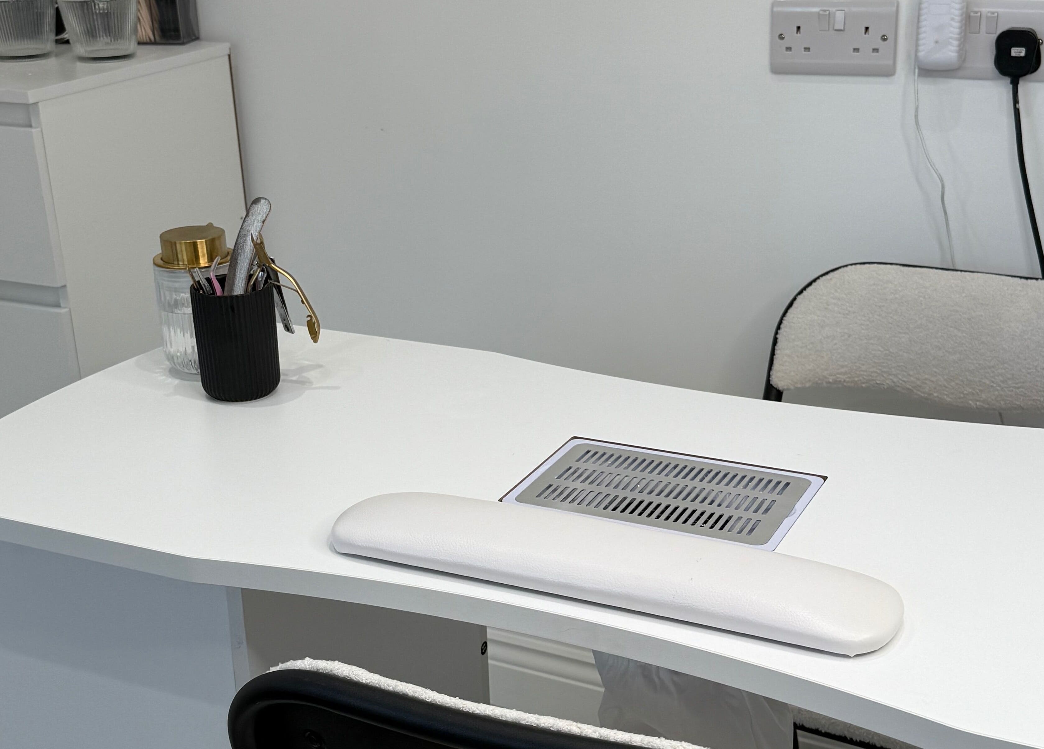 Modern Beauty nail station featuring sleek white decor in Newport, Wales, GB.