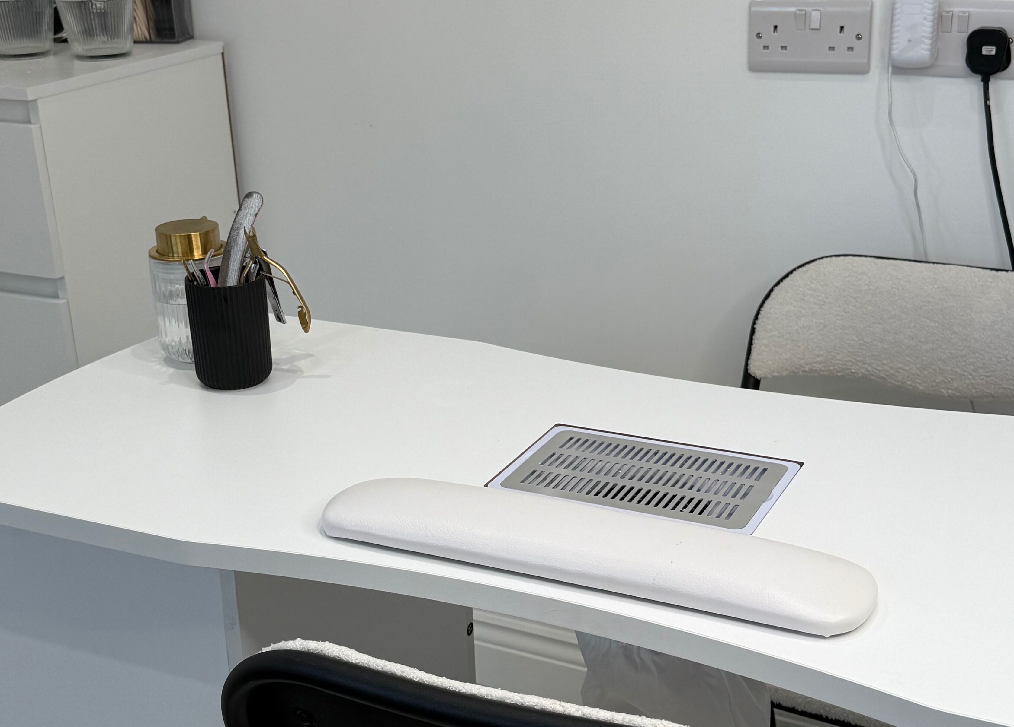 Modern Beauty nail station featuring sleek white decor in Newport, Wales, GB.