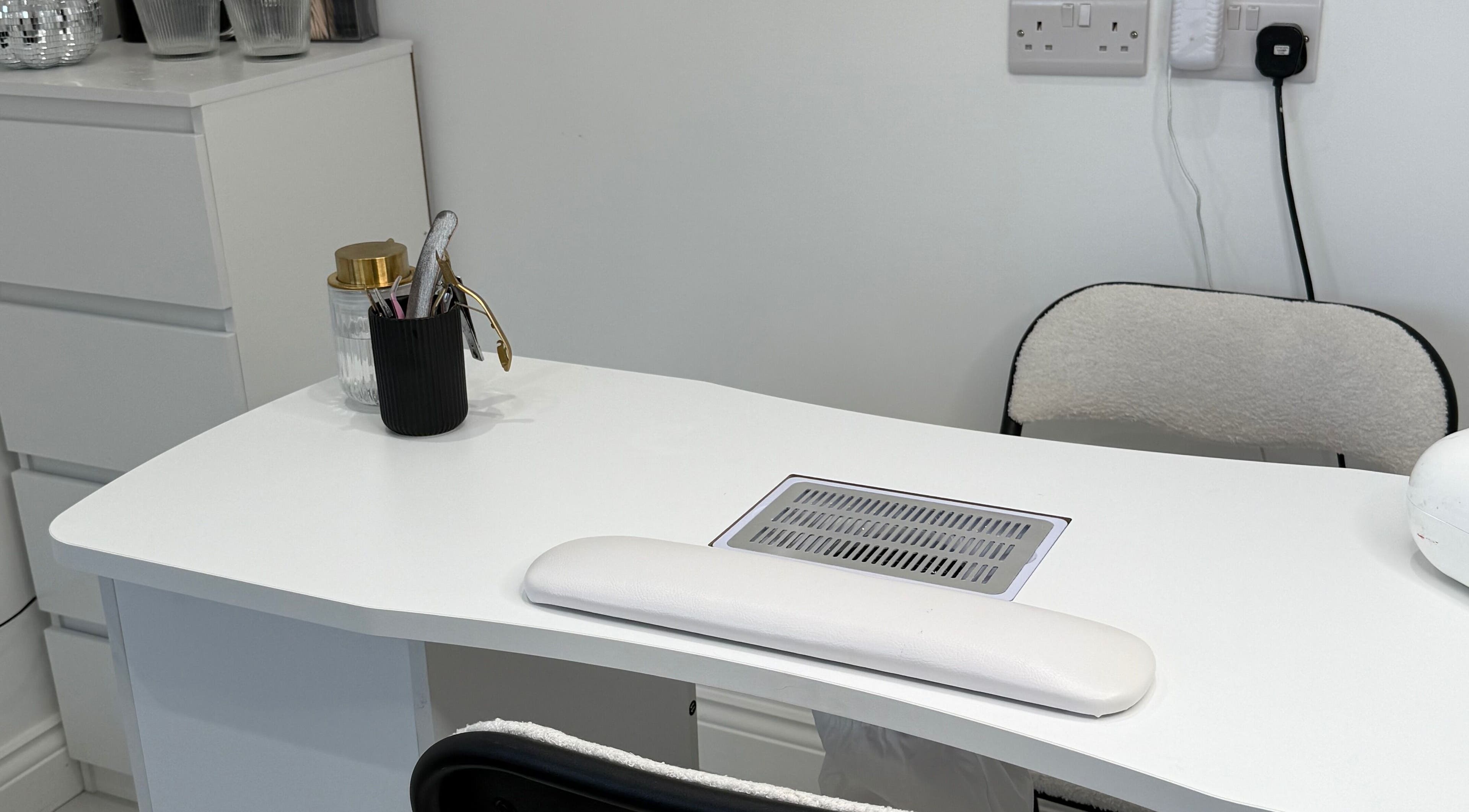 Modern Beauty nail station featuring sleek white decor in Newport, Wales, GB.