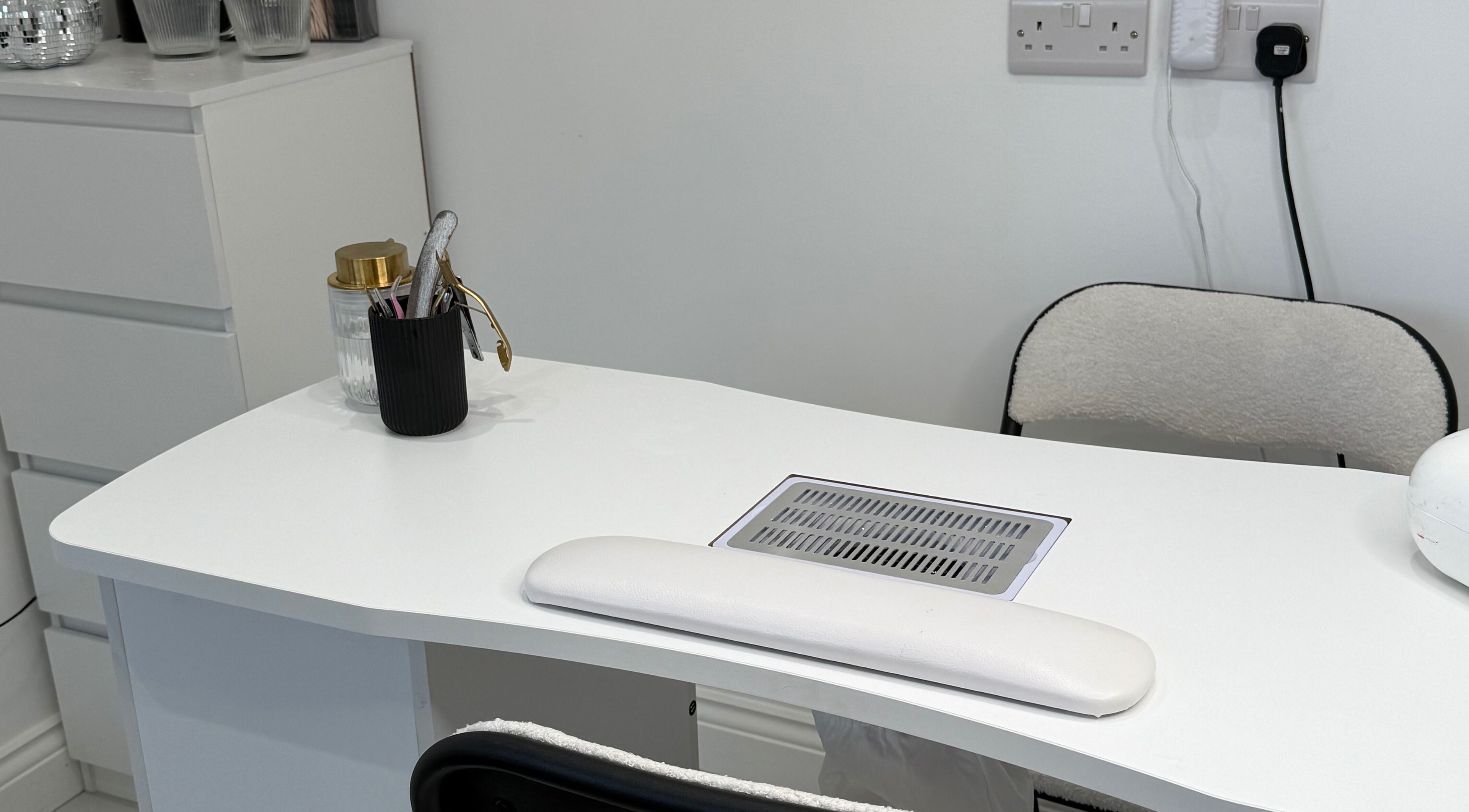 Modern Beauty nail station featuring sleek white decor in Newport, Wales, GB.