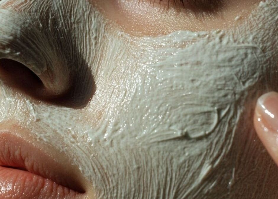 Smooth clay mask gently applied to face at Renew by Emily Leed, Long Ditton, England, GB for a radiant glow.