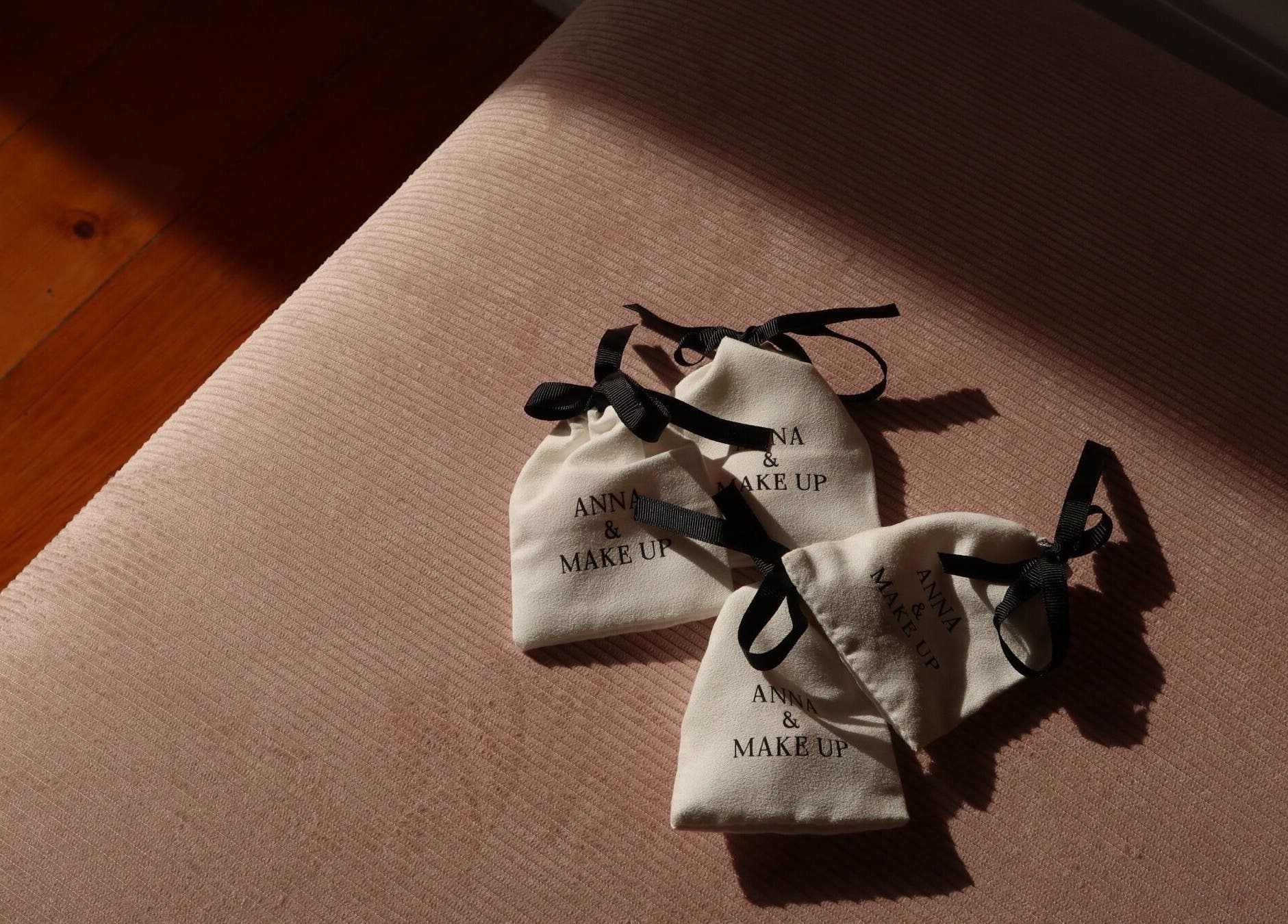 Elegant Anna and Make Up gift bags on a soft pink surface in Lisboa, Lisboa, PT.
