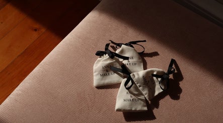 Elegant Anna and Make Up gift bags on a soft pink surface in Lisboa, Lisboa, PT.