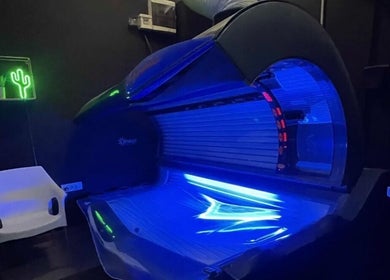 Modern tanning bed at Studio Omega in Novi Sad, Vojvodina, RS with ambient lighting and decor.