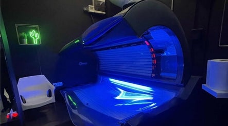Modern tanning bed at Studio Omega in Novi Sad, Vojvodina, RS with ambient lighting and decor.